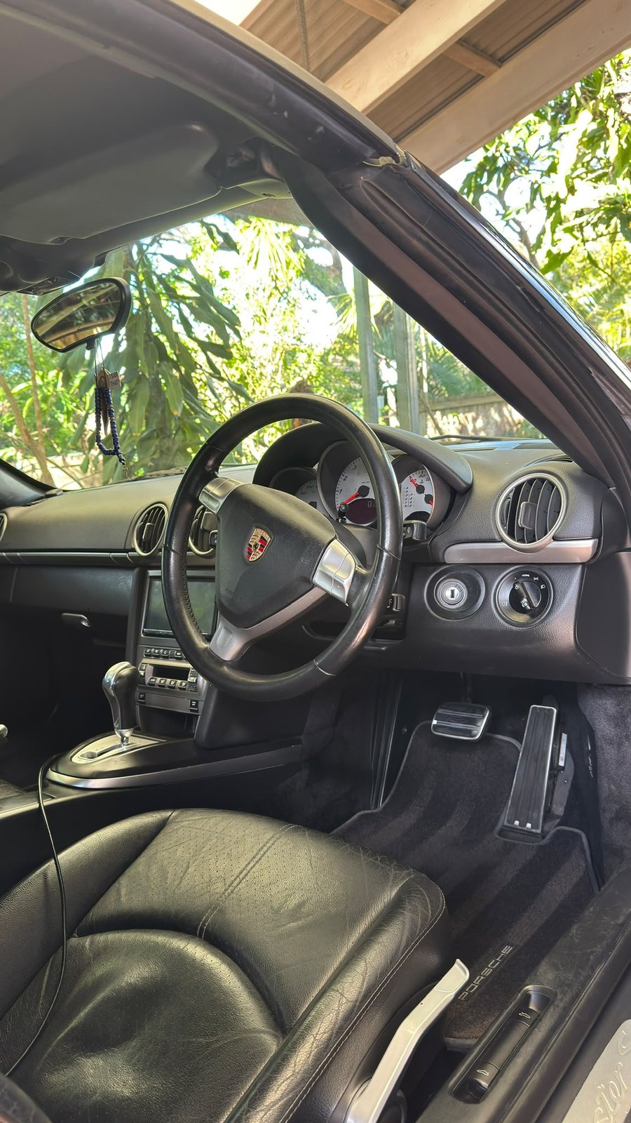 Clean Porsche cockpit, dashboard and steering wheel detailed
